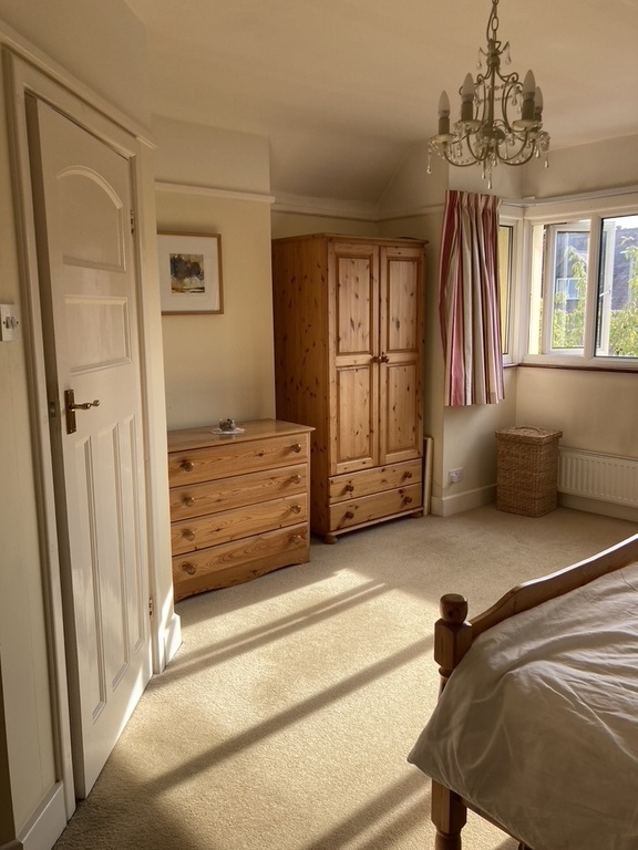 the main bedroom - with ensuite shower and toilet through the door on the left