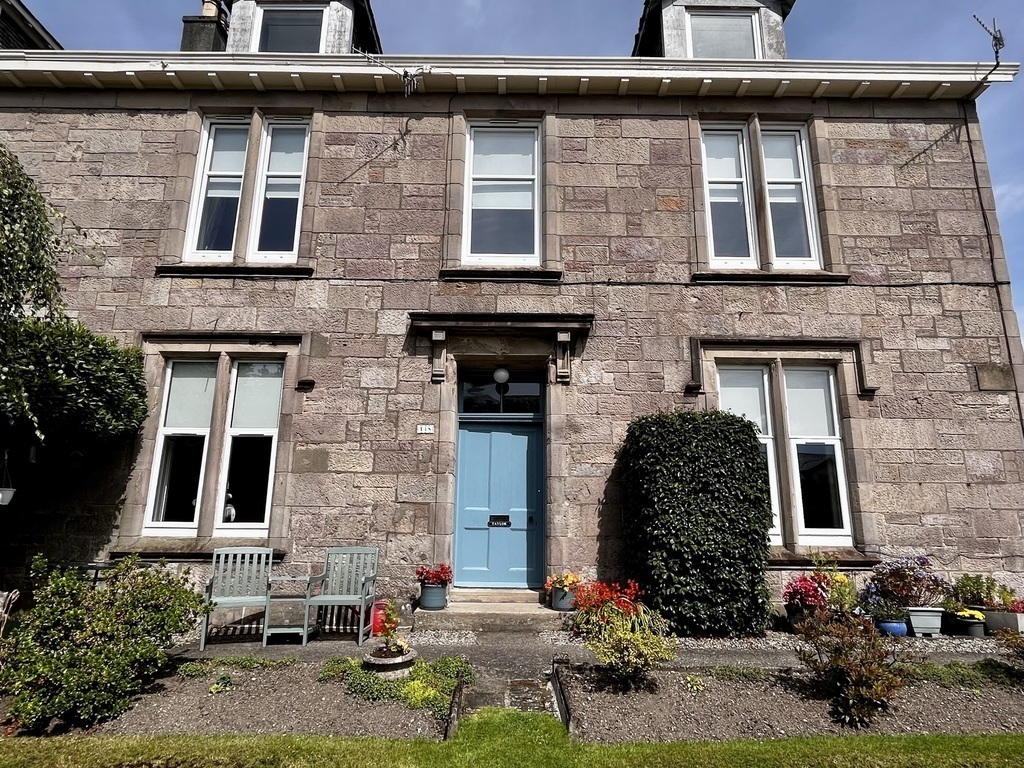 Front of home with storm door closed 