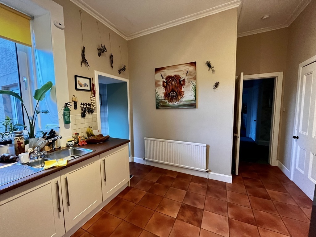 Kitchen leading into small dining area 