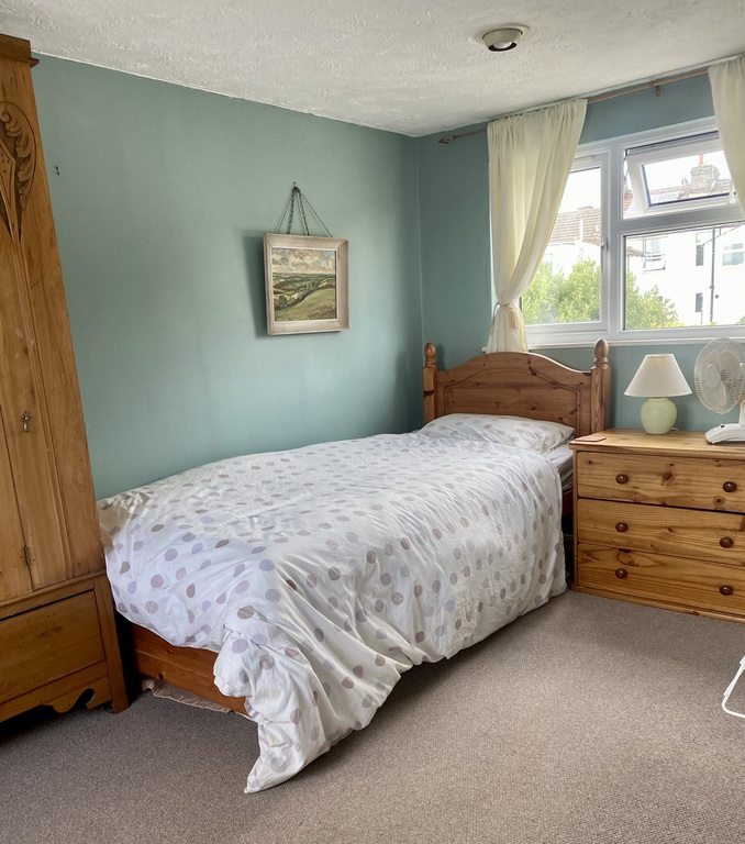 Top floor attic bedroom which has two beds and ensuite bathroom 