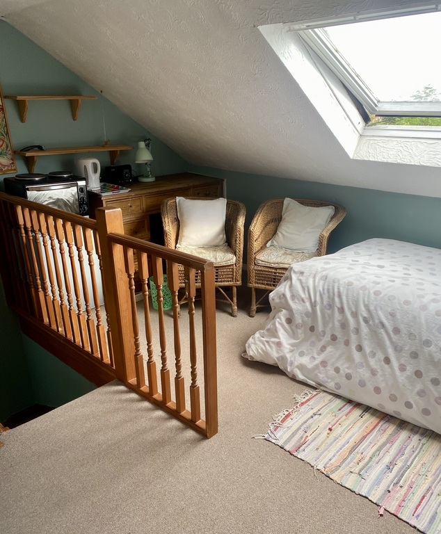 Top floor attic bedroom with two beds and ensuite bathroom 