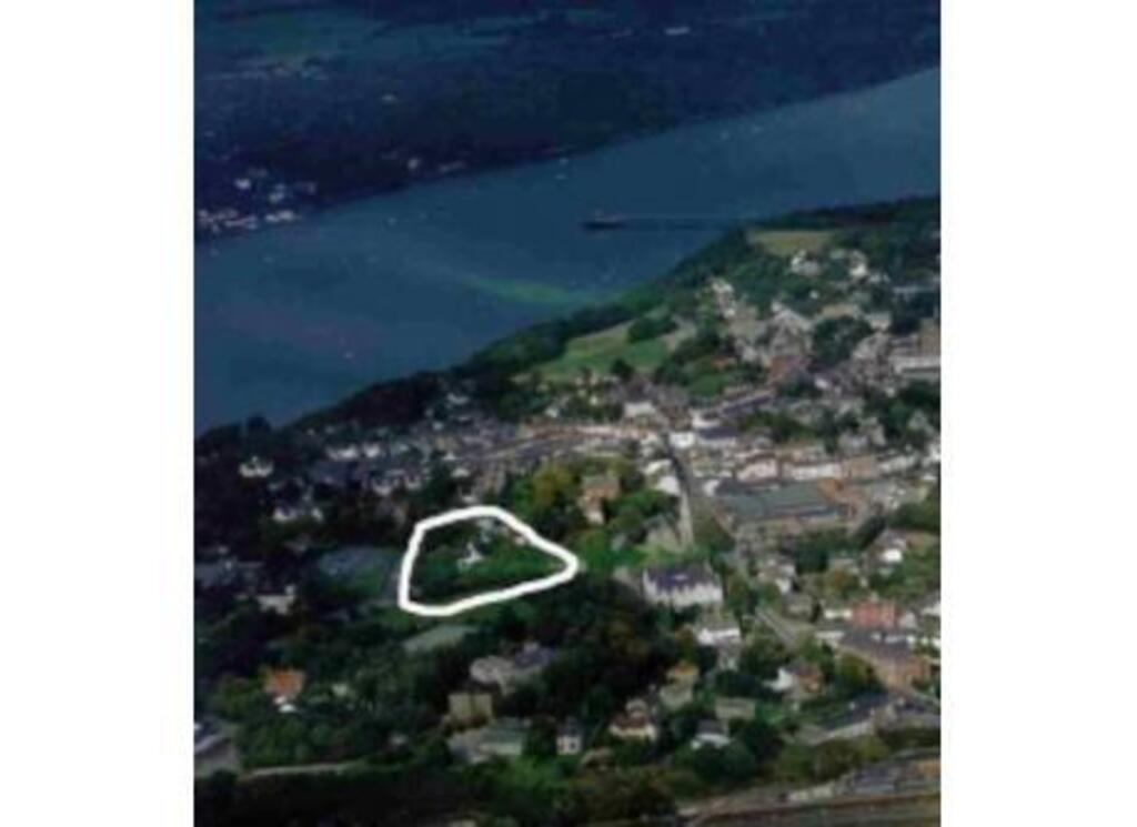 Aerial view of house with Menai Straits in the background