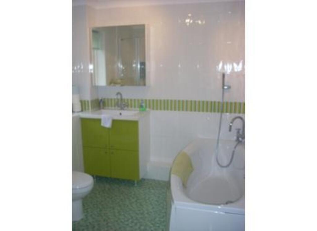 Family bathroom with bath and shower