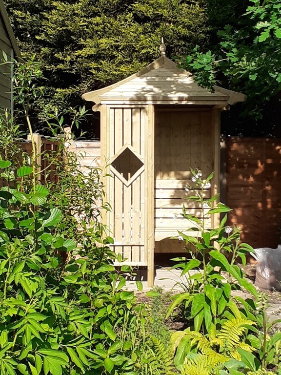 Corner gazebo in the rear woodland garden