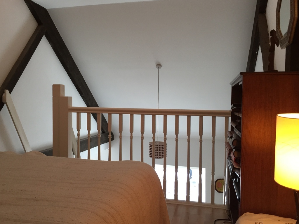 camp bed on open mezzanine