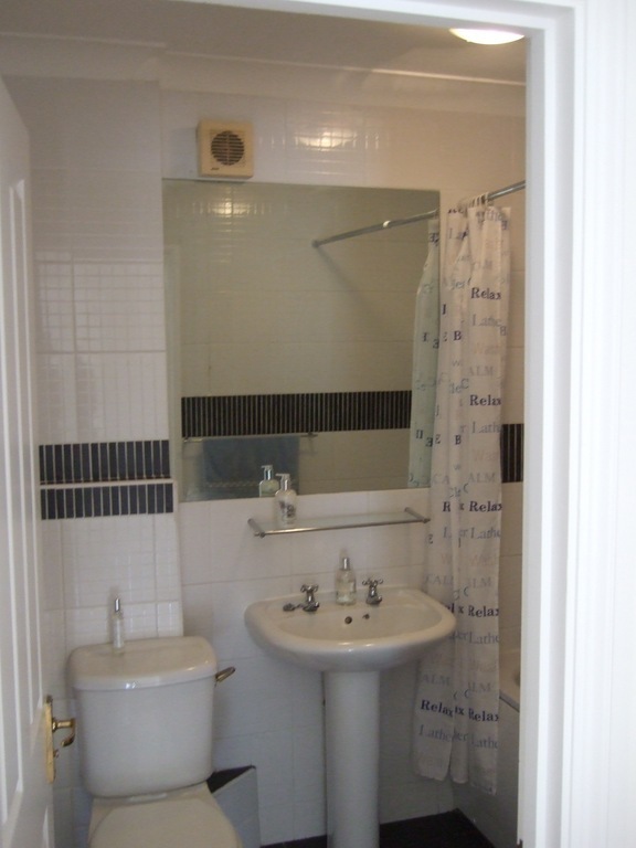 Chapel bathroom with bath and shower