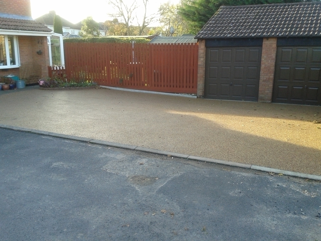 Double garage and parking area for four cars.