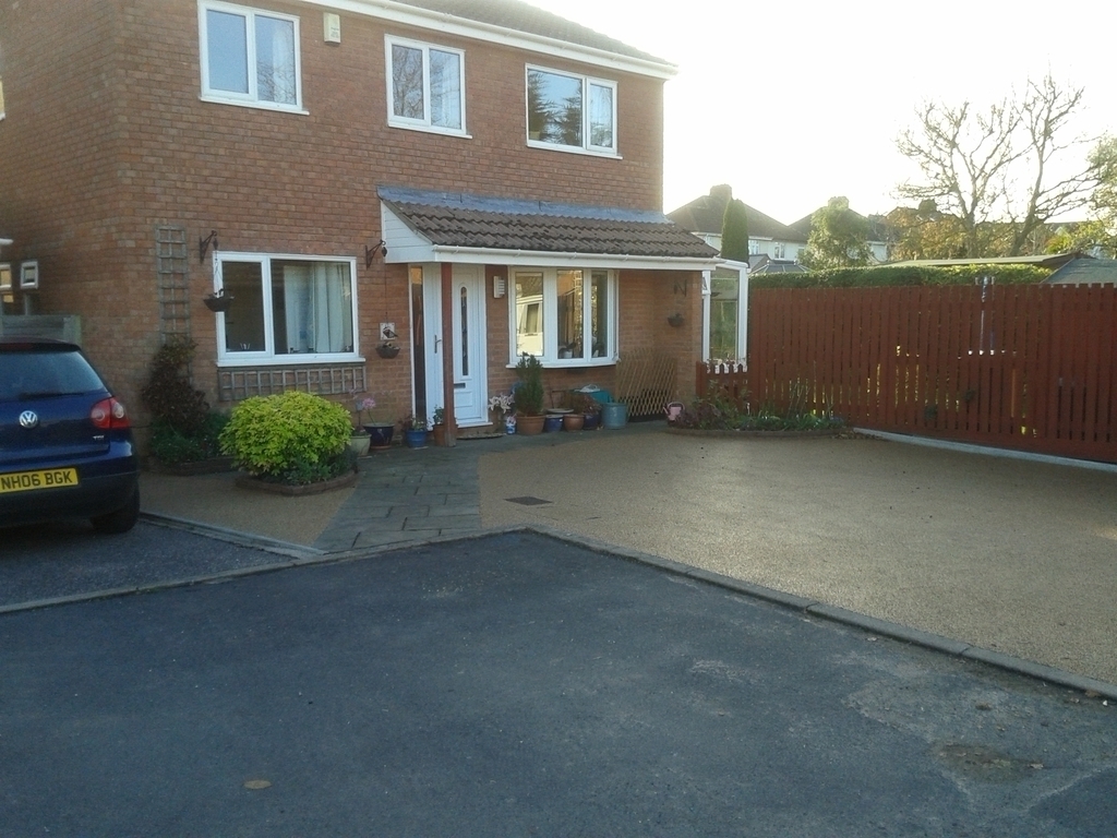 Parking area with house to the left