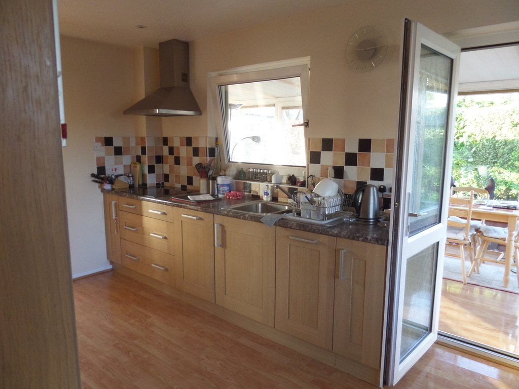 Kitchen with entrance to garden room.