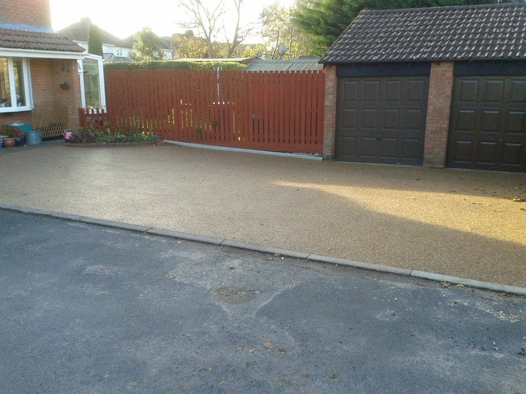Double garage and parking area for four cars.