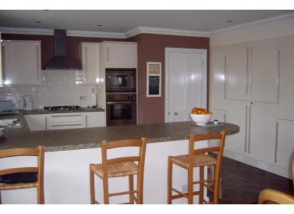 Breakfast bar and kitchen.