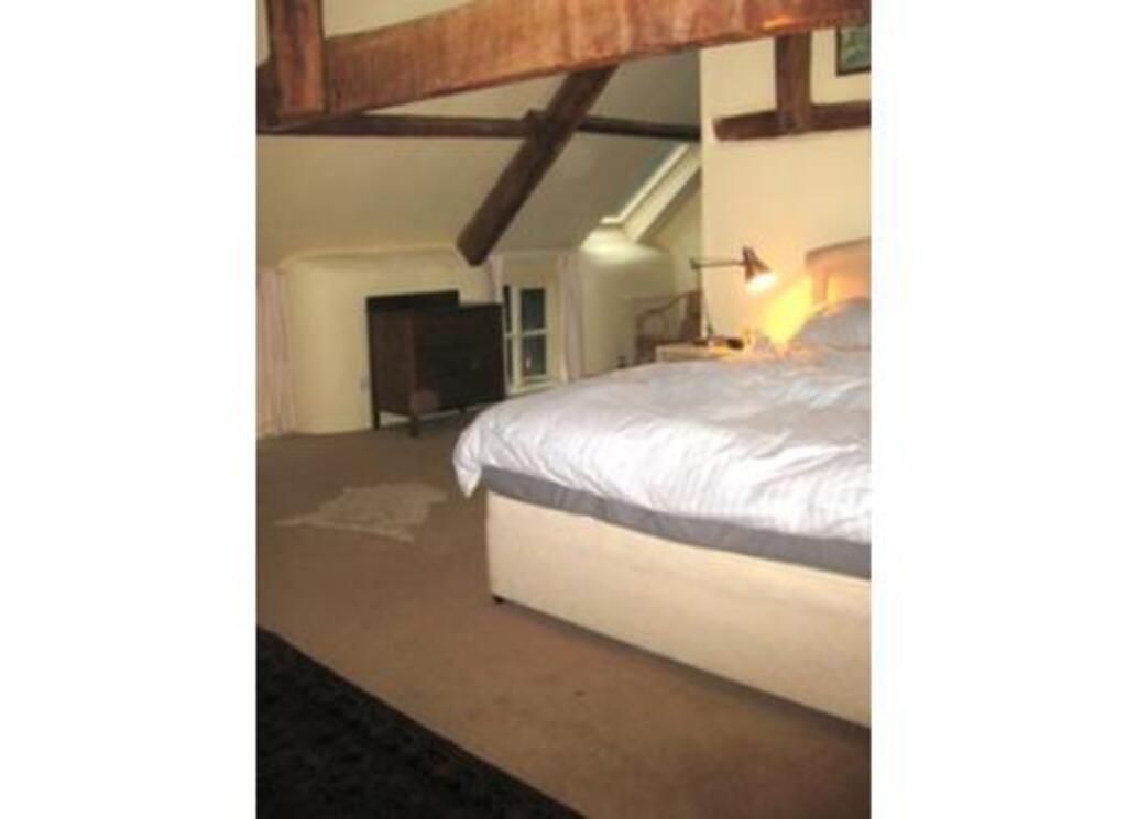 edge  of parents' bedroom