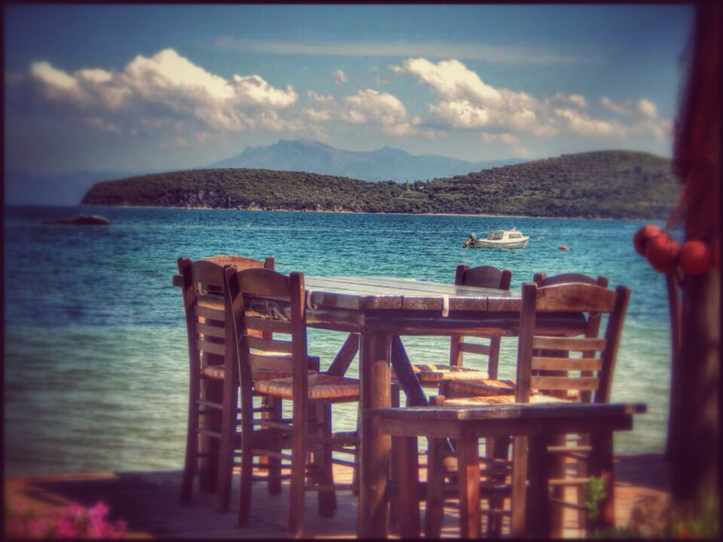 the tables in the sand and  by the murmuringof the sea!