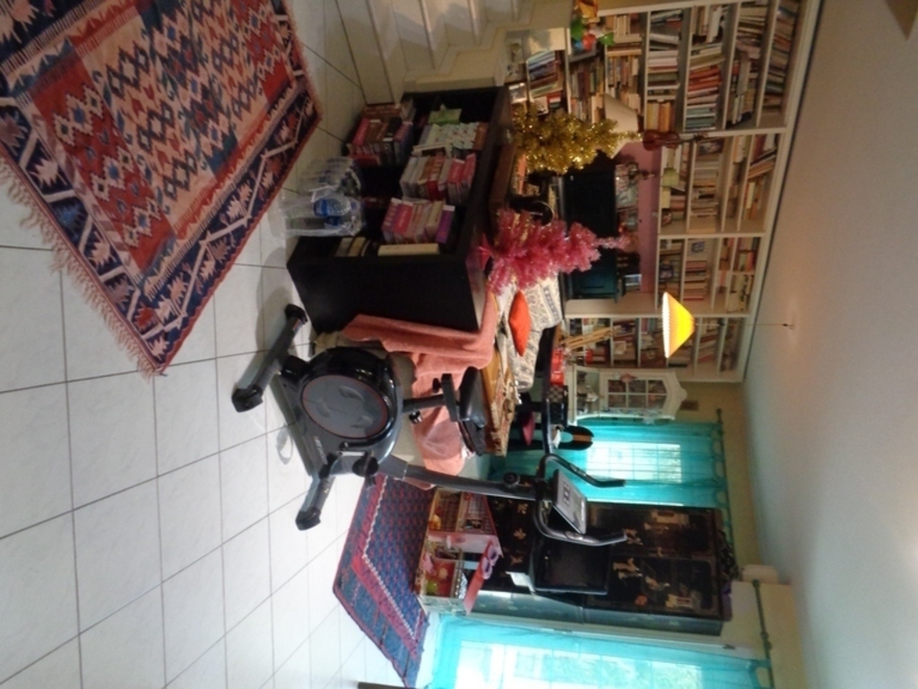 ground floor's view from kitchen area to tv  sitting and library