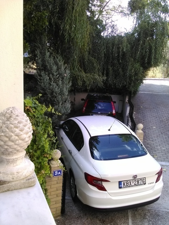 the open parking  space..white car, a one year   fiat  is  the  exchange  car