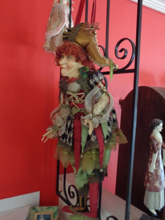 artfull doll hung  by staircase rail