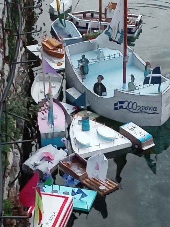 Drama-st.Barbara's srings tiny lake...people leave handmade boat toys on church celebrationSt.Barbar's