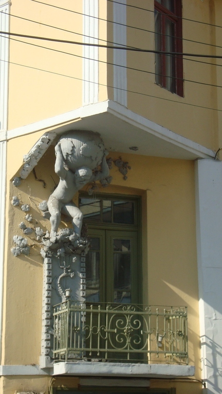 ATLAS, the   mythical  giant..carrying  the  house  on  his   shoulders