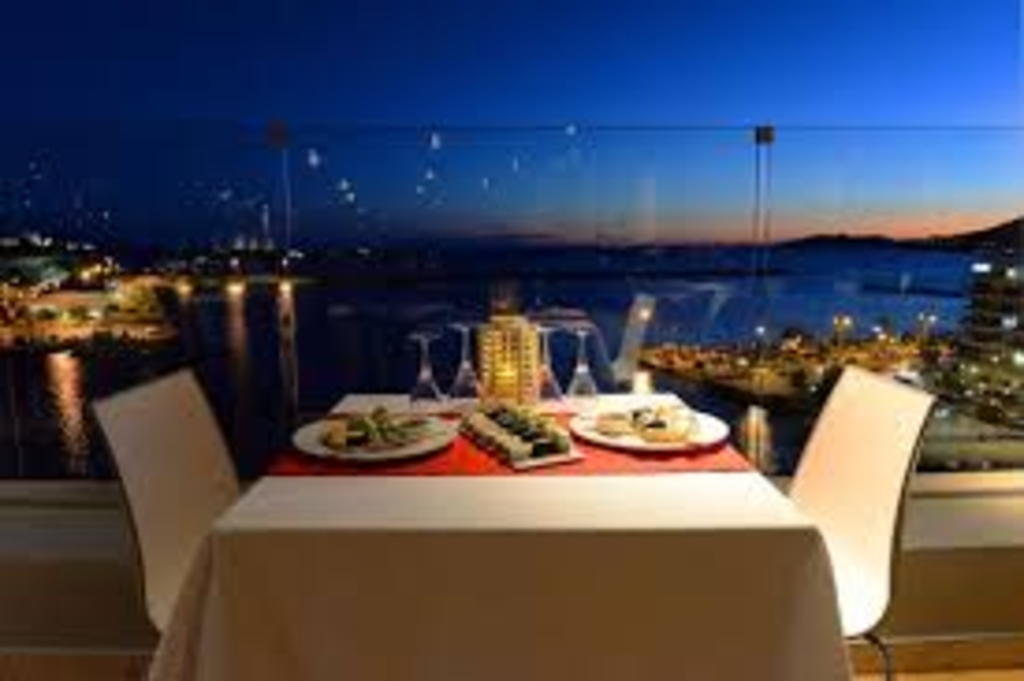 SUMMER  DINNER ON  ROOF-TOP  RESTAURANTS OF   HOTELS IN KAVALA