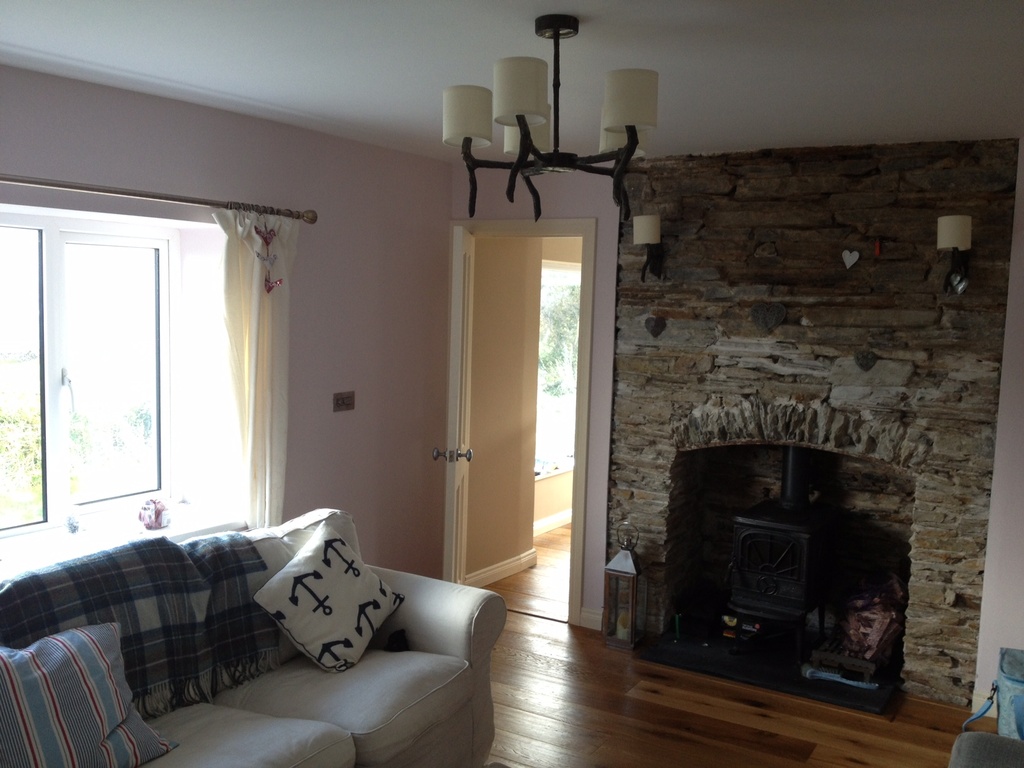 Living Room showing the original stonework of the cottage.