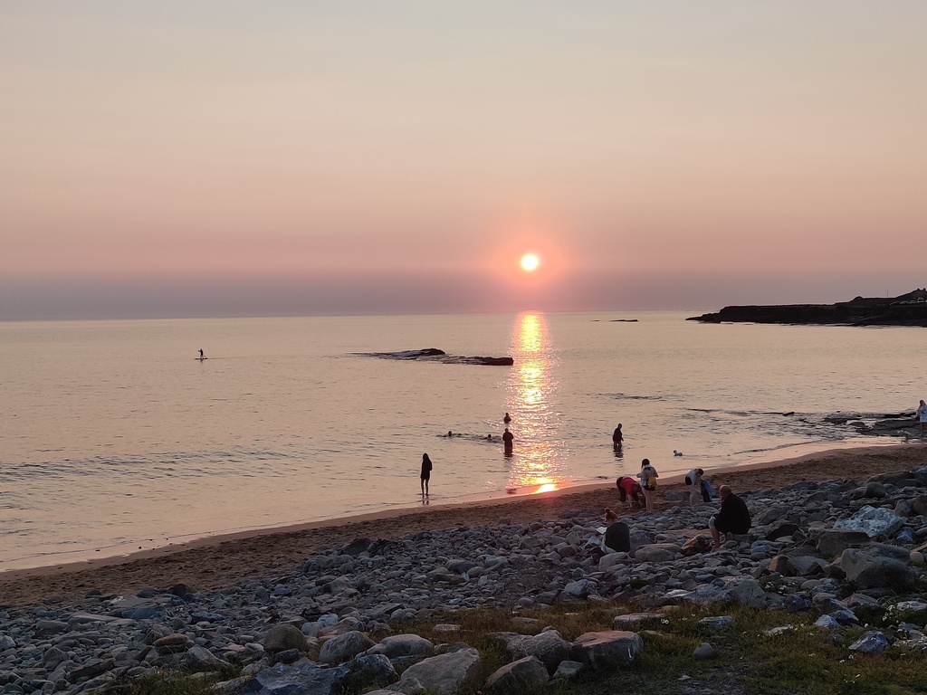 Spanish Point beach with the tide in as the sun sets