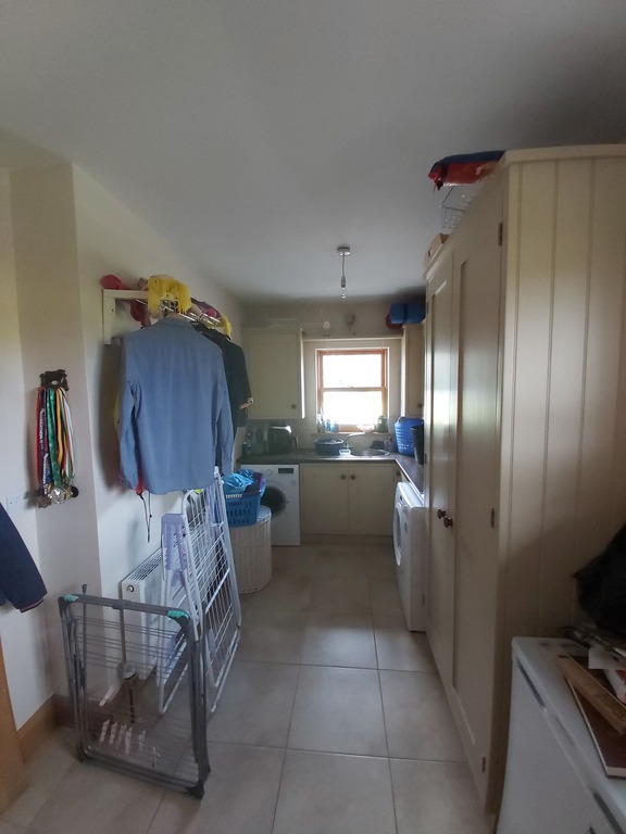 utility room with washer and dryer and ninja airfryer