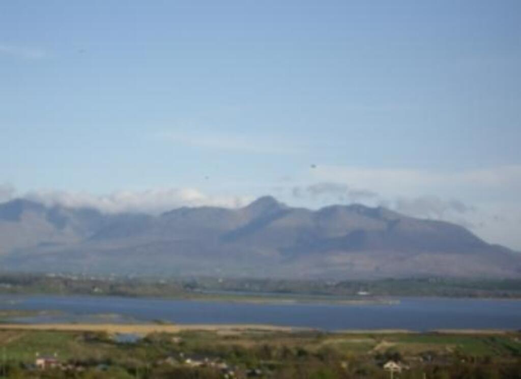 View of Carrauntowohill mountain, (highest mountain in Ireland, across the sea from the cottage.