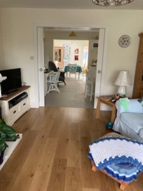 From sitting room through to dining room