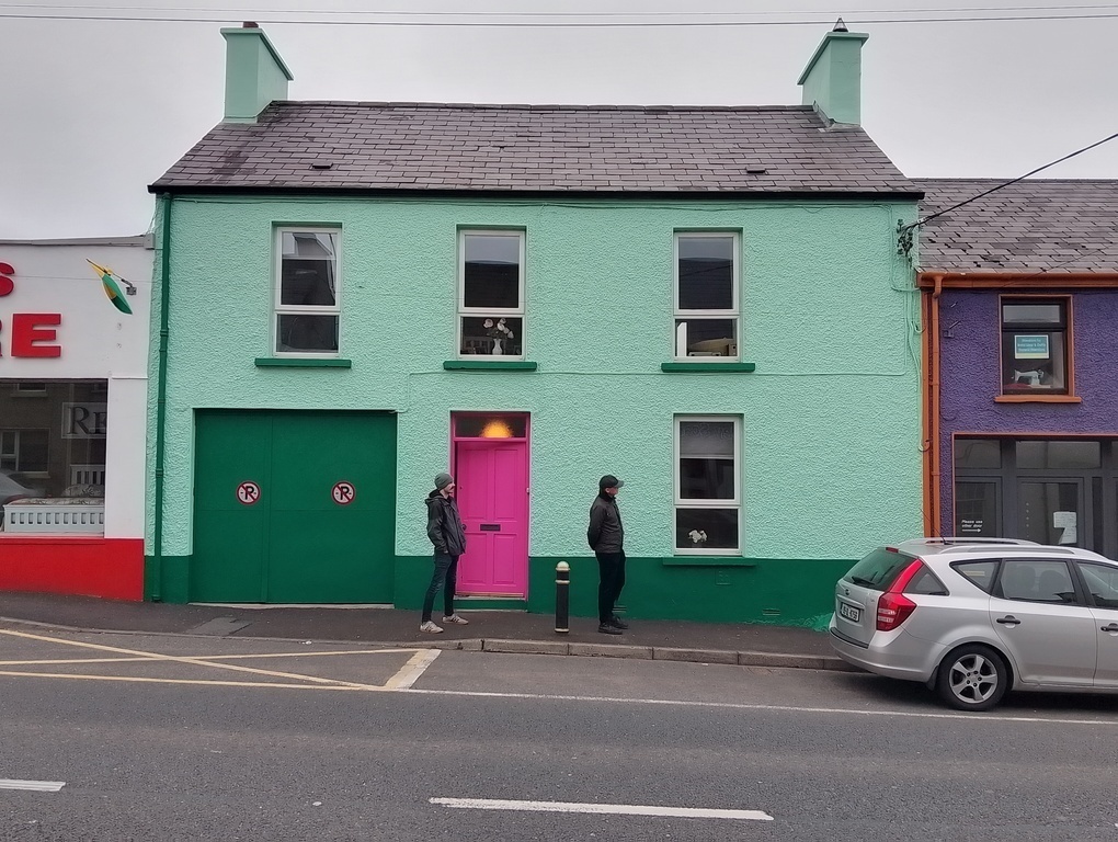 Front of house - gated vehicle entrance to the side
