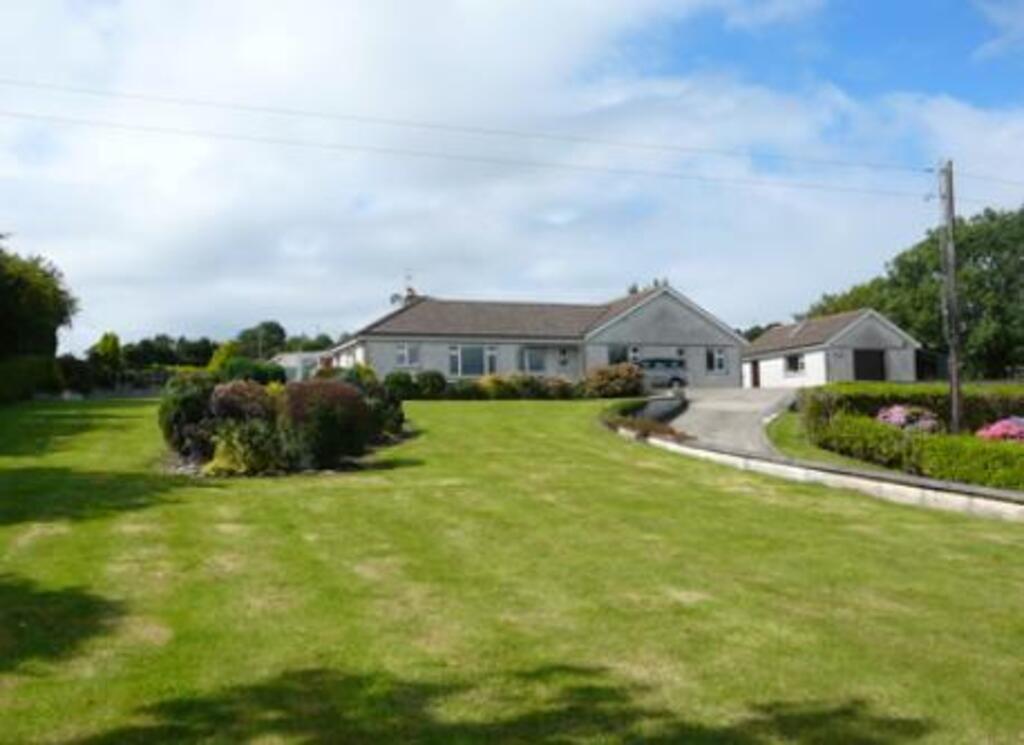 Front garden and house, seen from the road. 