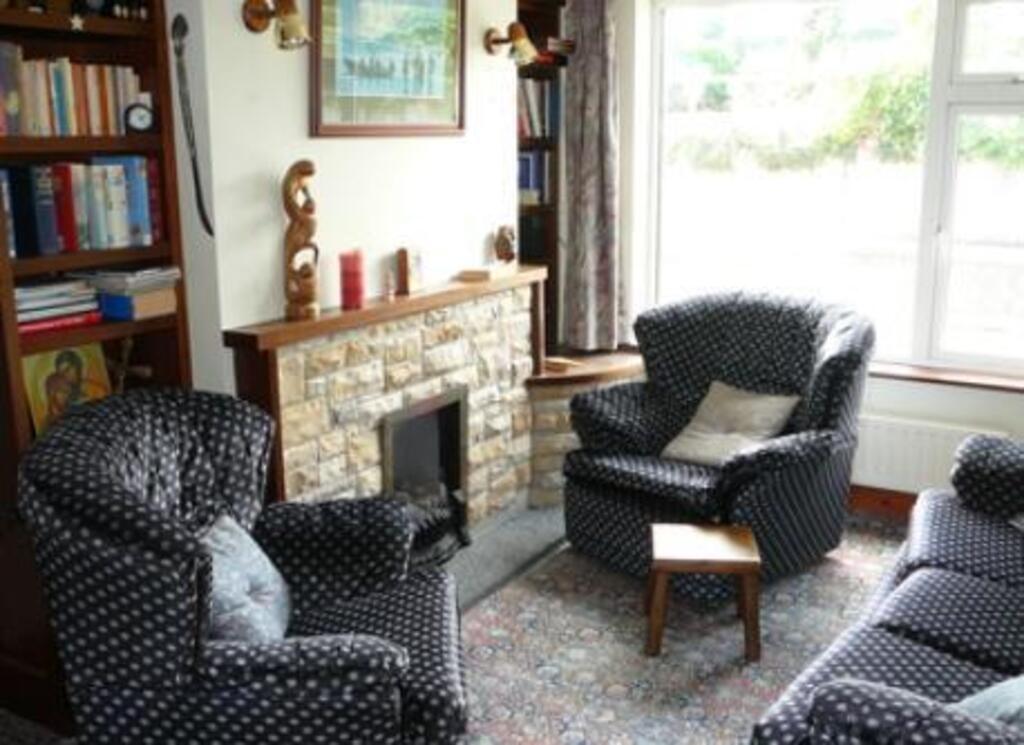 Sitting Room. It's beside the bigger Living Room. 