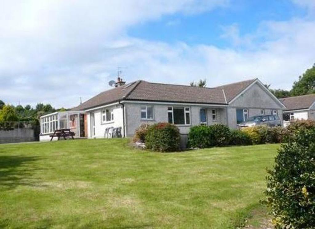 Front garden (one of 4 gardens) + front of house.