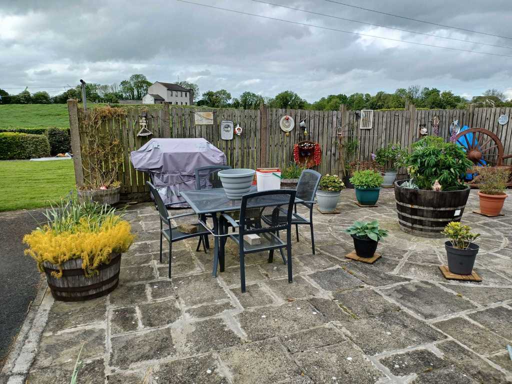 The left side of our patio with barbeque and table