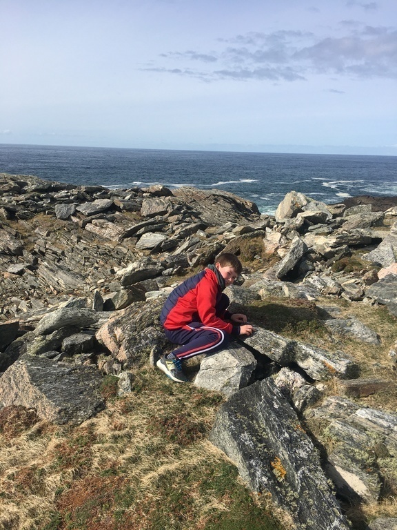 My son rock climbing beach close to our house