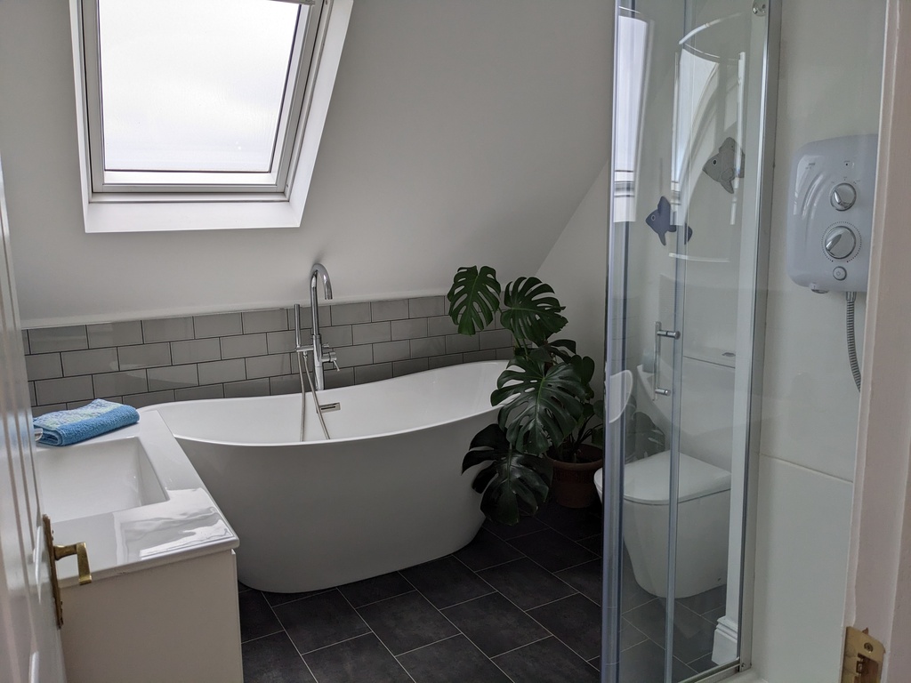 Upstairs bathroom, shower and bath