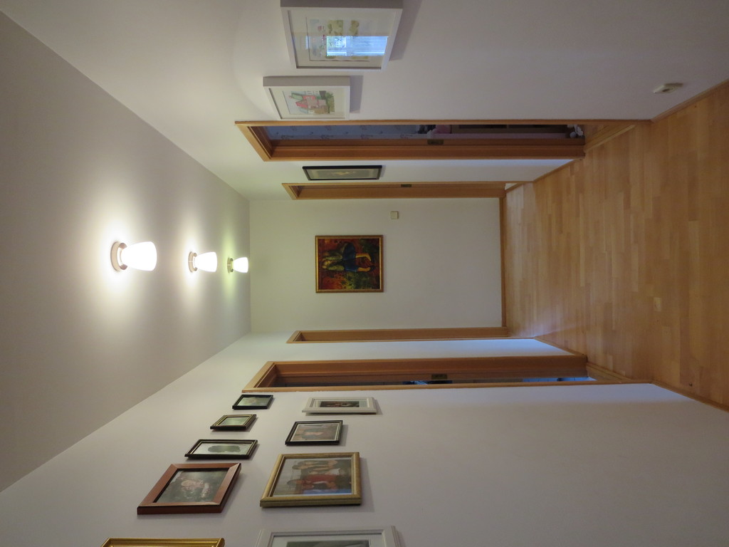 The hallway. There are two bedrooms to the right and the bathroom and a bedroom to the left.
