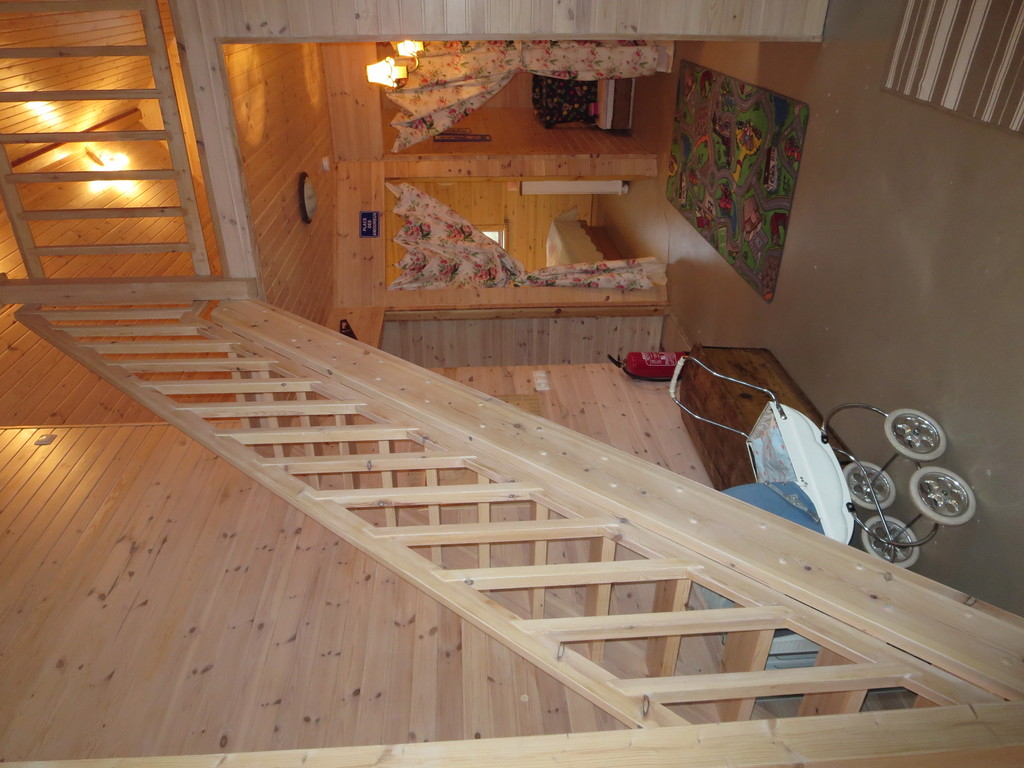 Cottage: The stairs leading to the loft and entrances to the two bedrooms.