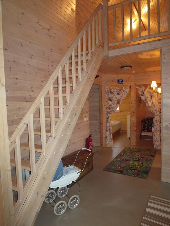 Cottage: The stairs leading to the loft and entrances to the two bedrooms.