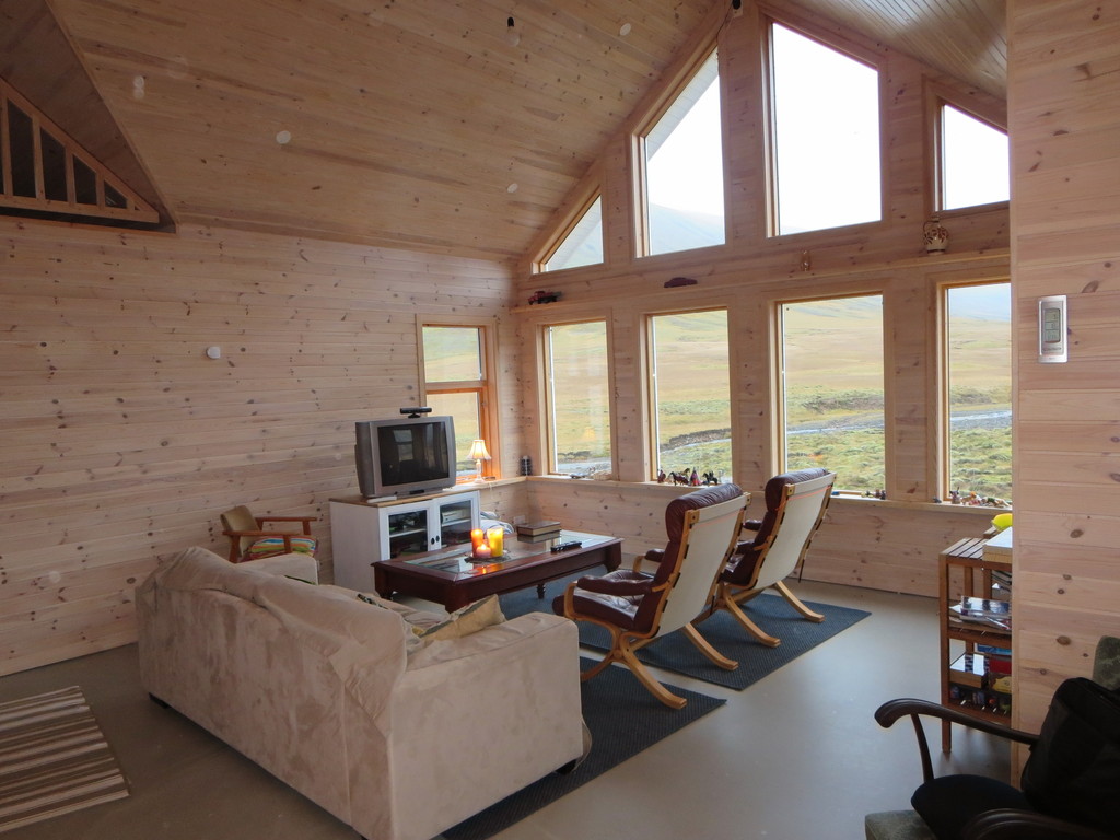The living area in the cottage. You can see the river outside the window.