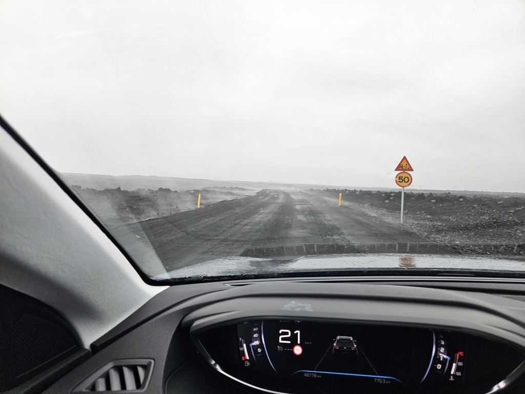 This is the road to Grindavík shortly after one of the volcanoes. The road is steaming.