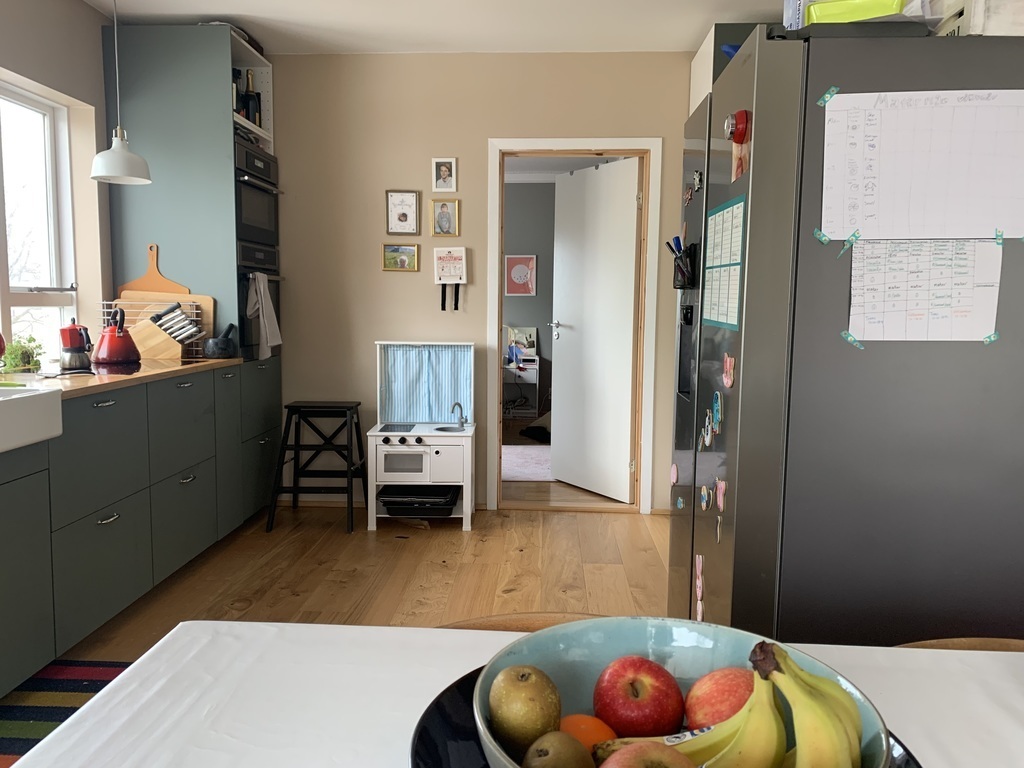 Kitchen seen from dining room table. 2 ovens (one is both an oven and microwave) and our daughter's mini kitchen ;-) 