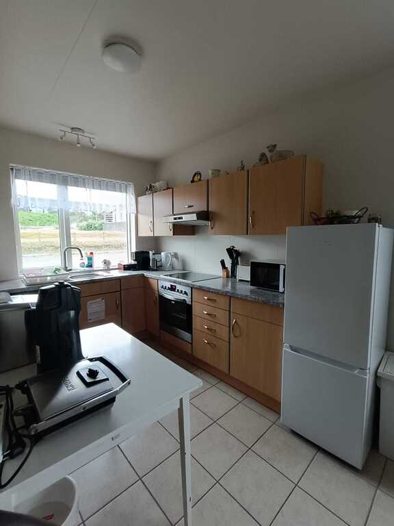 The kitchen in the other apartment.