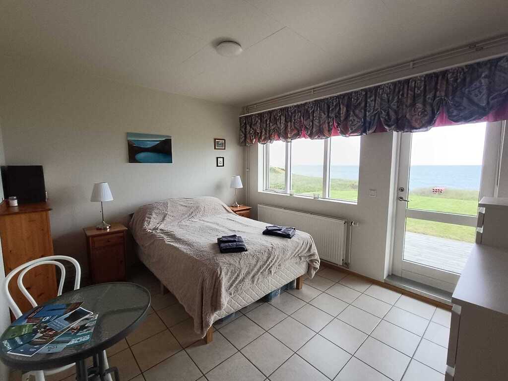 The guest room, with a door to the back yard.  In the other apartment.