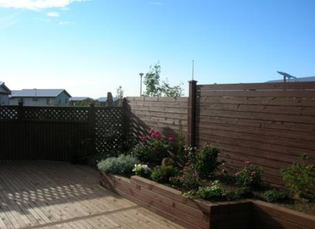 big outdoor terrace with a grill and furnitures
