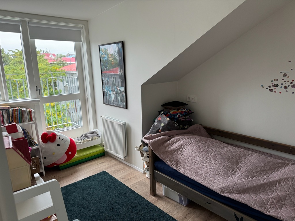 upper floor bedroom - small balcony facing north