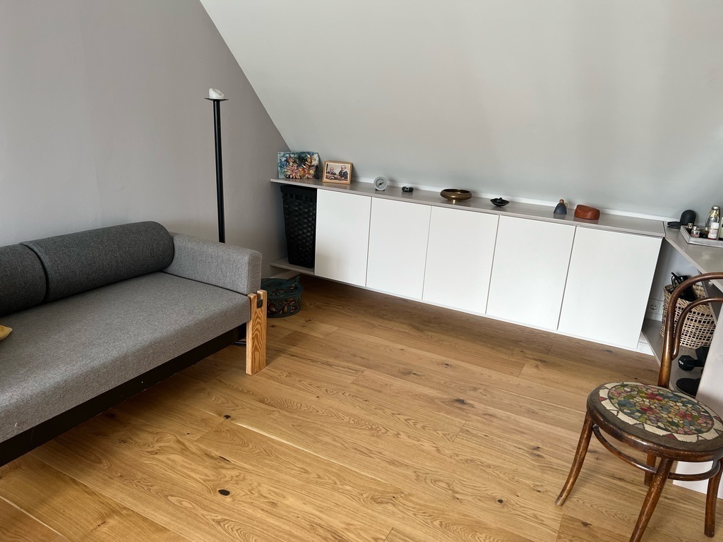 The other end of the bedroom has a sloping ceiling that makes it very cosy.