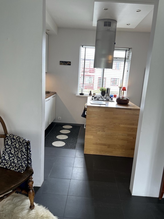 You can enter the kitchen from both the living room and the corridor. We love to cook in our small but functional kitchen