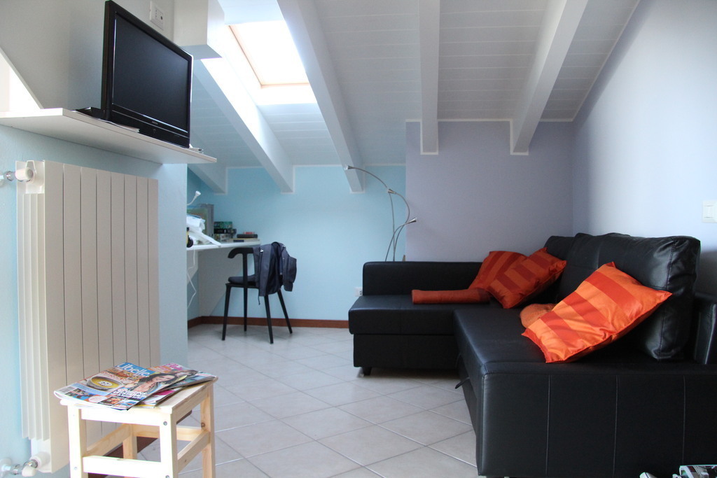 livingroom first floor, black seats are also beds for 2 persons