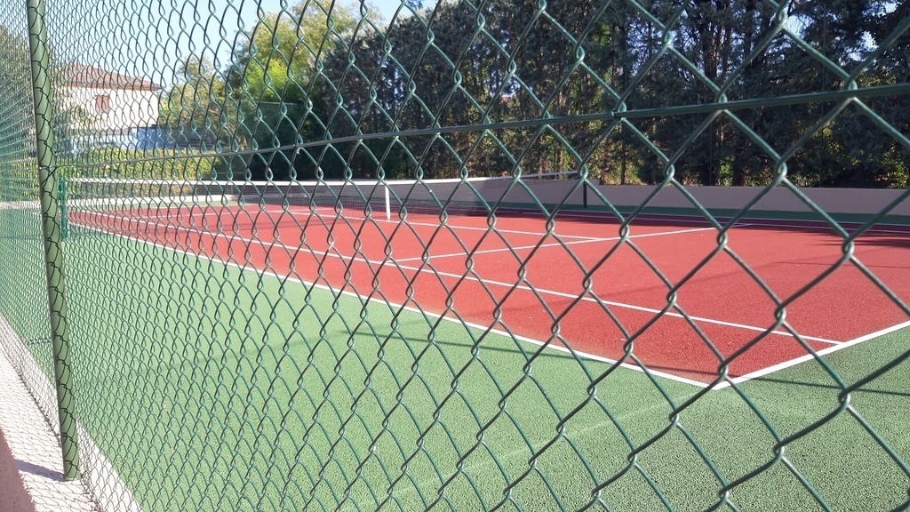 hardcourt tennis court and table tennis area in rear of residence