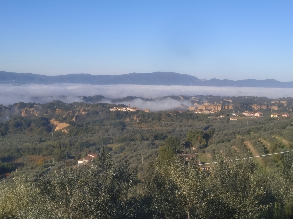 Landscape of the Valdarno, under the fog, with the Balze, visible from the surroundings of Certignano.